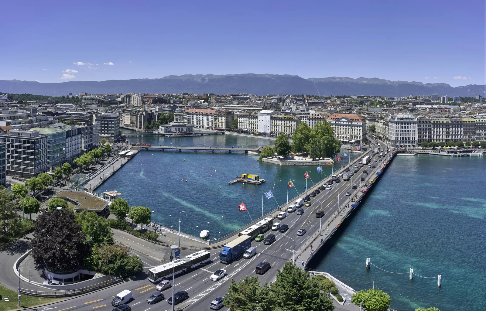 Geneva rooftops and the blue expanse of Lake Geneva.